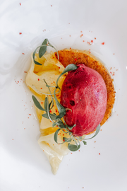 a close up of a plate of food that looks like a pomegranate