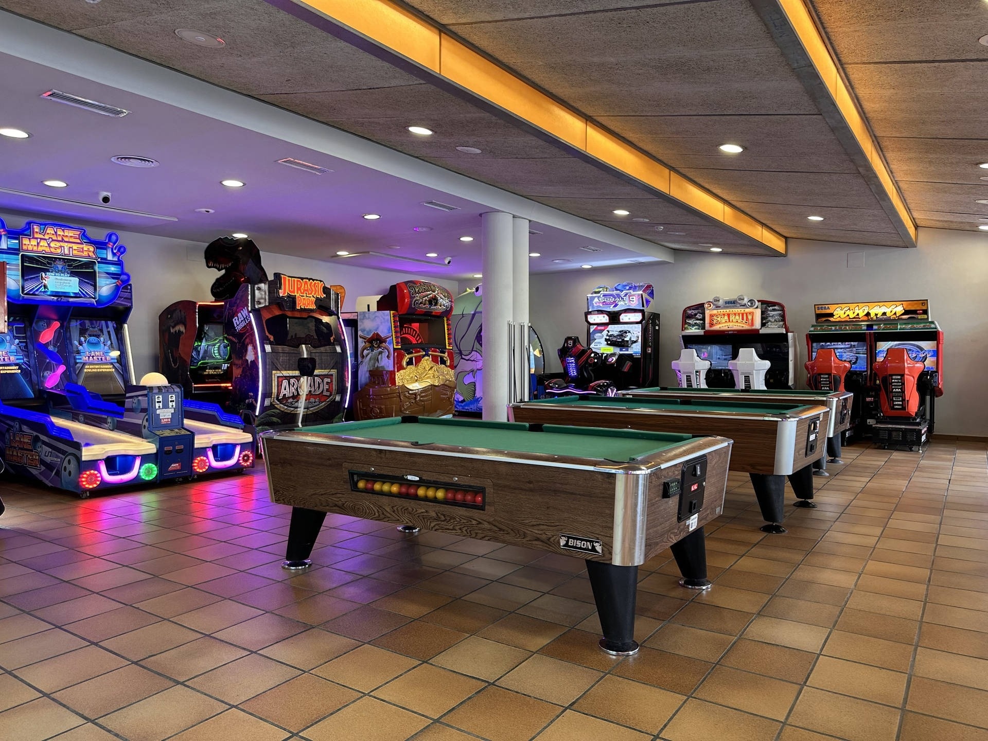 a pool table in an arcade with a game that says ' arcade ' on it