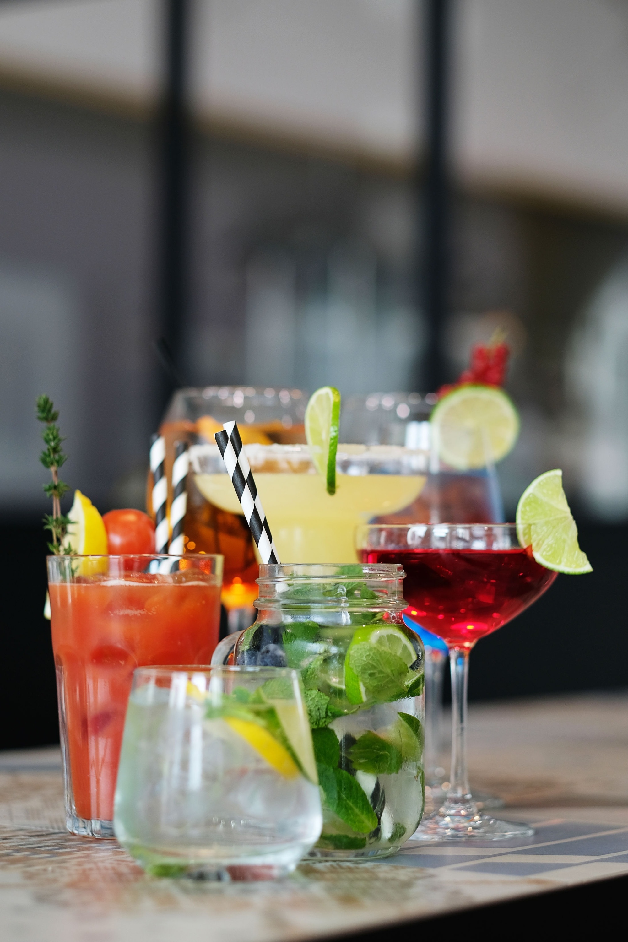 a variety of drinks are lined up on a table