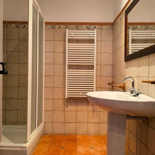 a bathroom with a sink and a towel rack