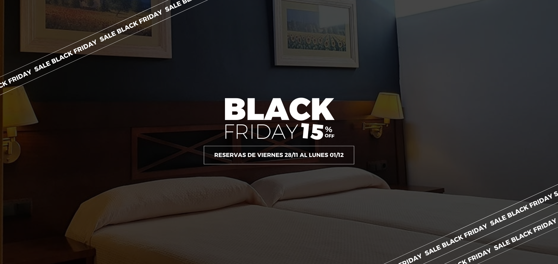 una habitación con dos camas y dos cuadros en la pared