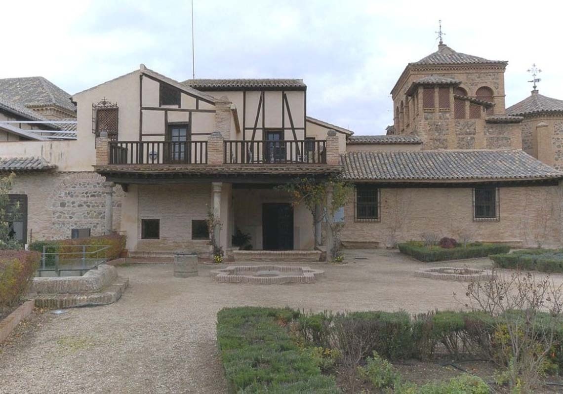 a large building with a steeple in the middle of a city