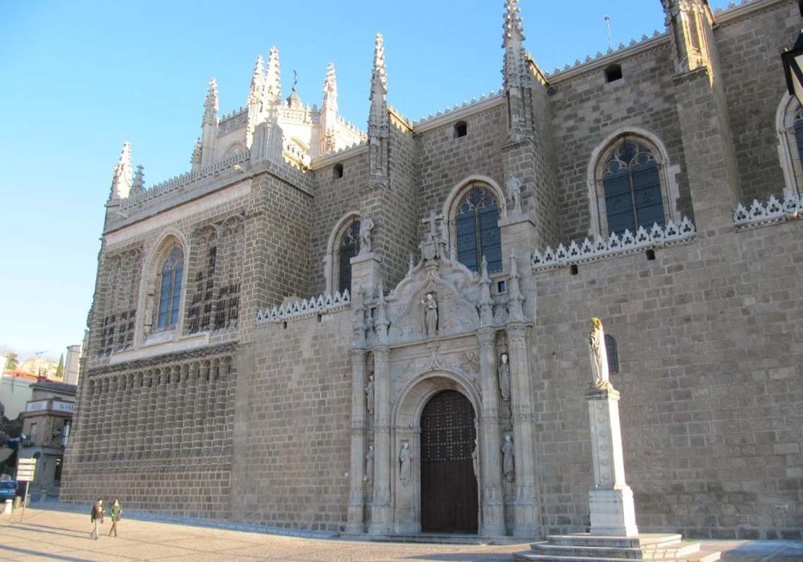 a large building with a steeple in the middle of a city