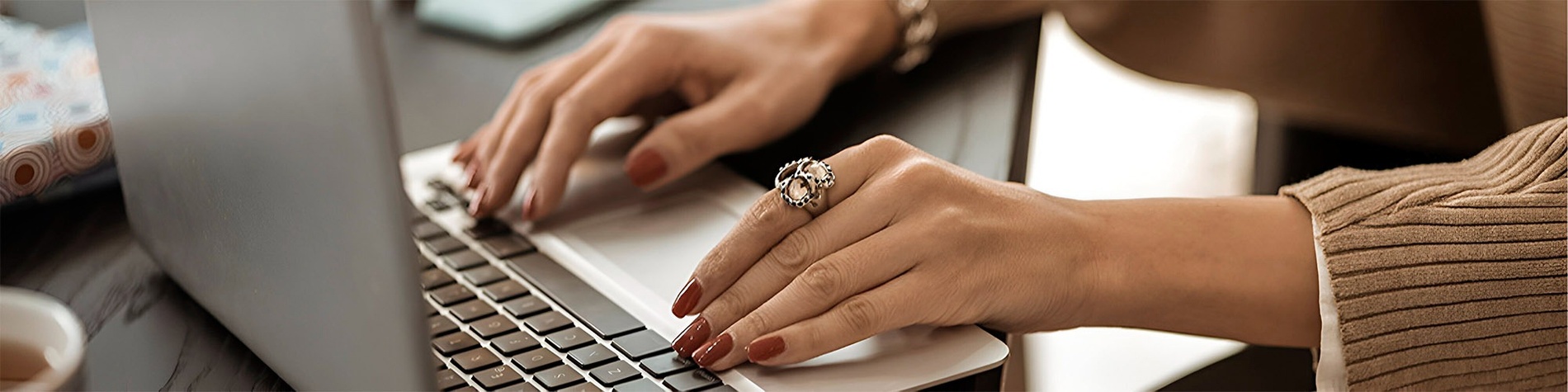 a close up of a person 's hand using a computer mouse .