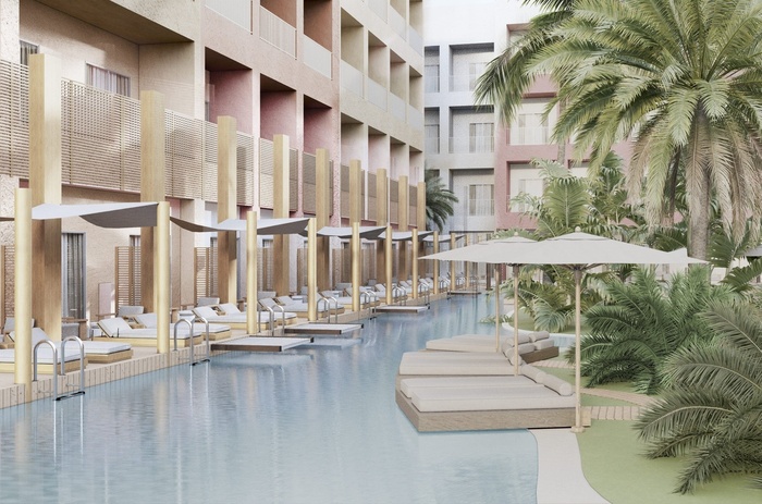 una piscina rodeada de muebles y sombrillas en un hotel