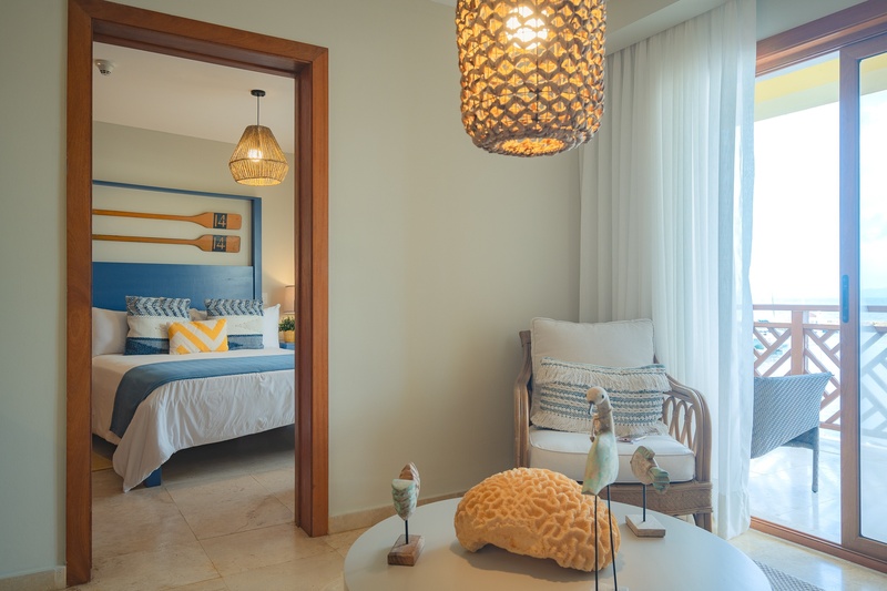 a bedroom with a sliding glass door leading to a balcony