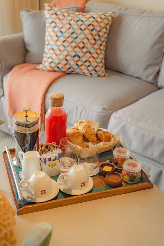 a tray with illy coffee cups and croissants on it