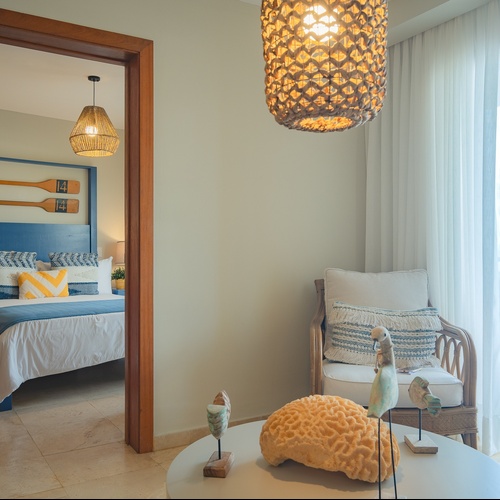 a bedroom with a sliding glass door leading to a balcony