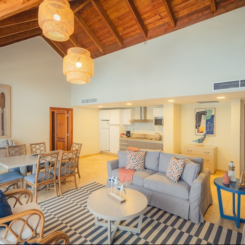 a living room with a couch a table and chairs