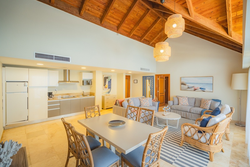 a living room with a couch a table and chairs