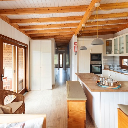 a kitchen with a fire extinguisher on the wall