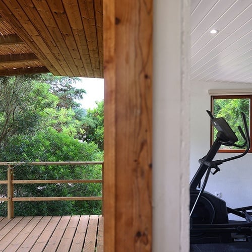 a view of a deck and an elliptical machine