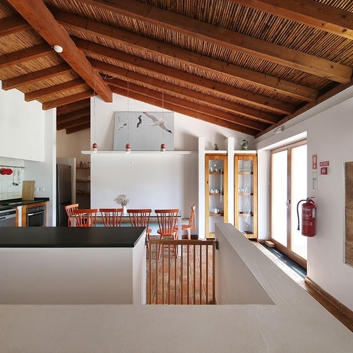 a kitchen with a fire extinguisher on the wall