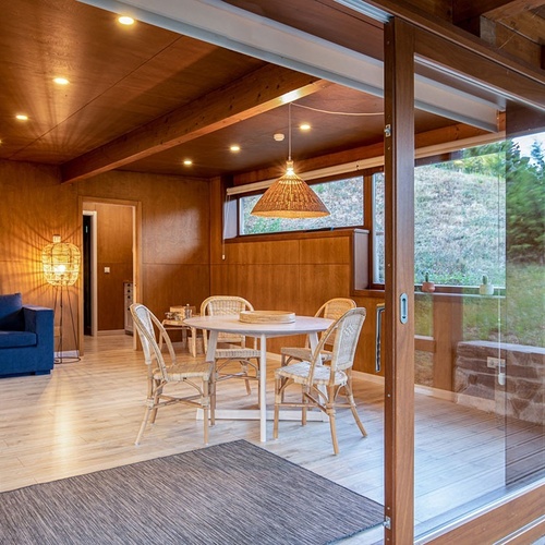 a room with a table and chairs in it