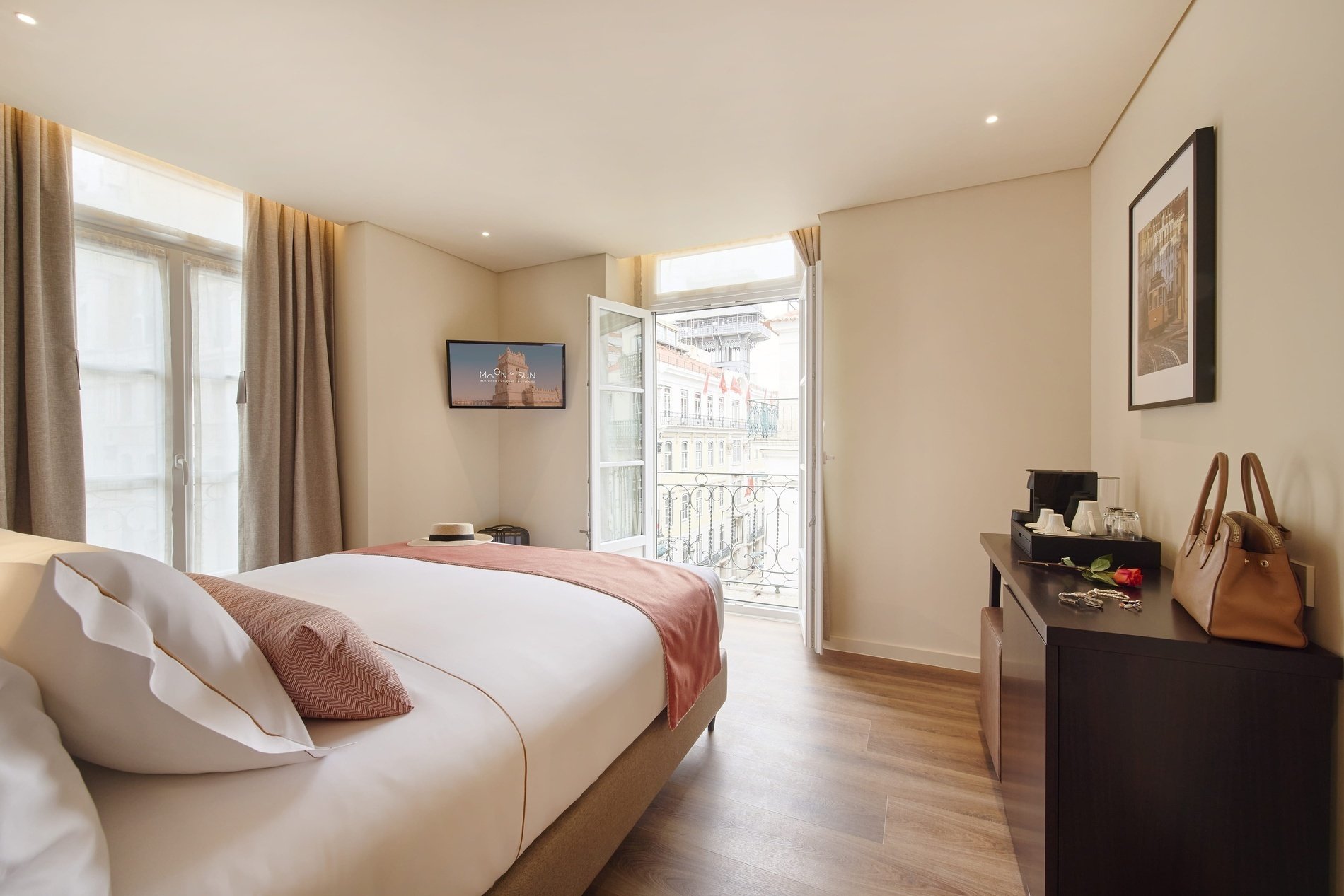 a hotel room with a king size bed and a flat screen tv