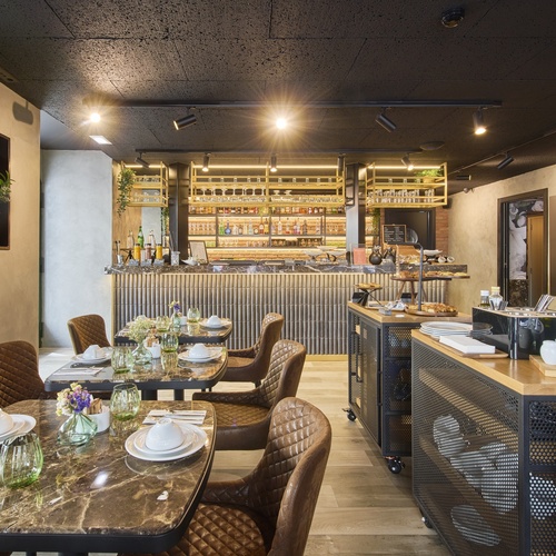 a restaurant with tables and chairs and a counter