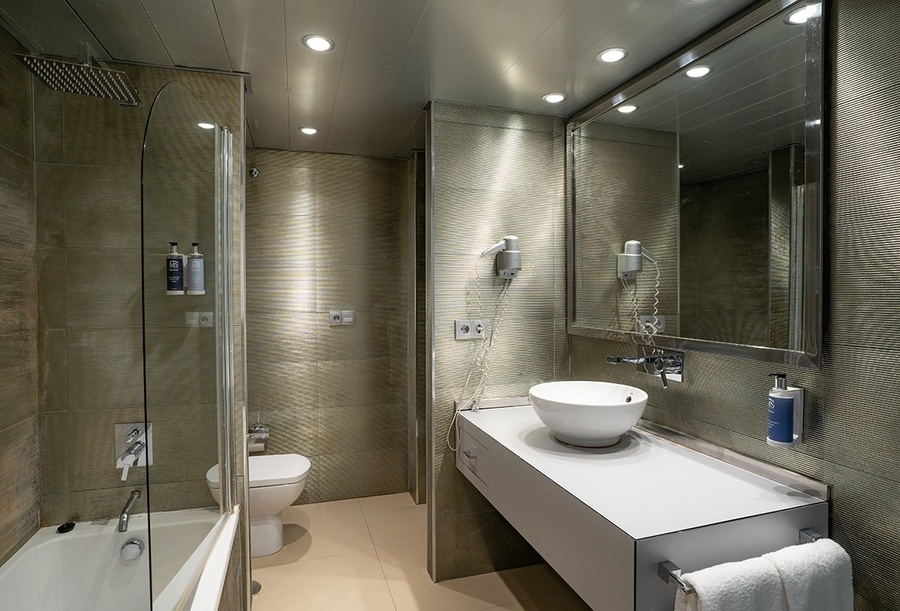 a bathroom with a toilet a sink and a mirror