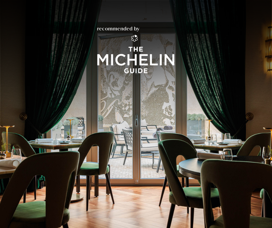 a restaurant with green chairs and tables is featured in the michelin guide