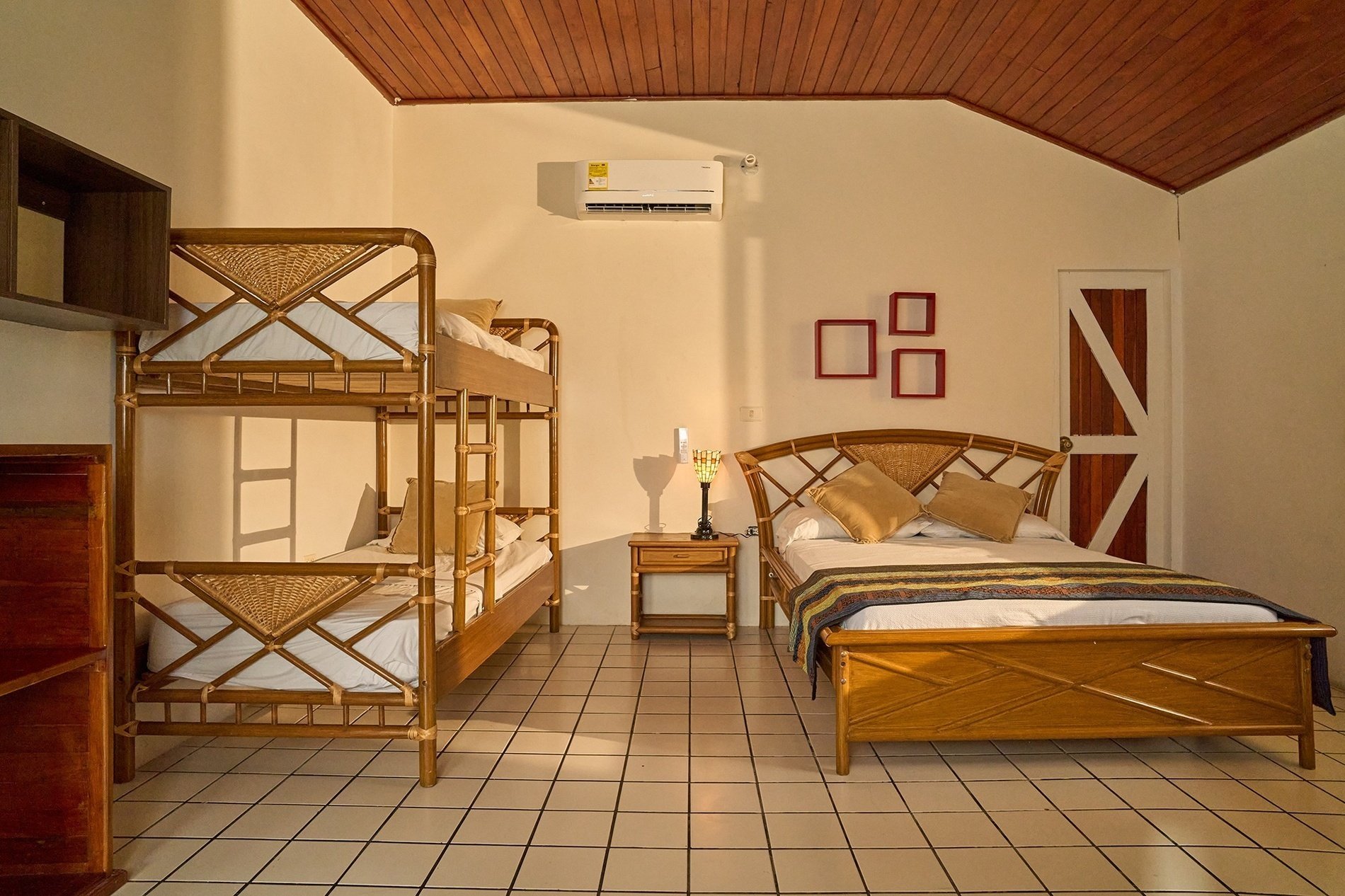 a bedroom with a bunk bed and a king size bed