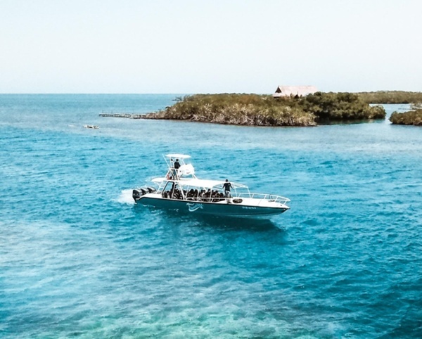 an aerial view of a boat in the ocean