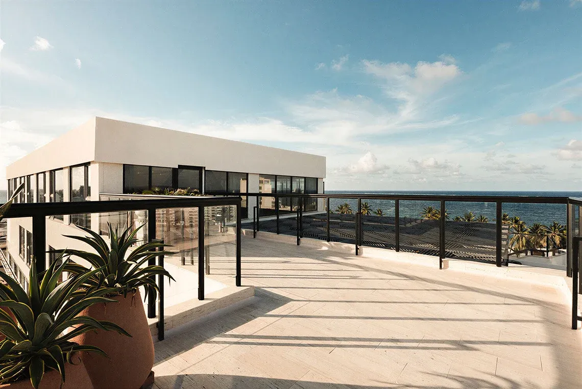 Modern rooftop terrace with ocean views and lounge area - ideal for Nattivo Collection Hotel.