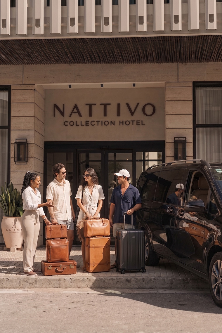 Hotel guests and staff with luggage outside Nattivo Nattivo Collection Hotel Collection Hotel.