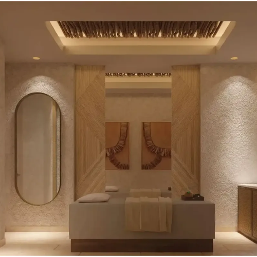 Spa de lujo con camilla, espejos y decoración natural. Nattivo Collection Hotel