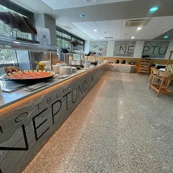 Hotel Neptuno buffet breakfast with diverse dishes and modern decor.