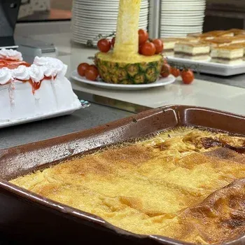 Creamy dessert in a terracotta dish at Neptuno Hotels.