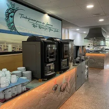 On Hotels: Neptuno buffet with coffee machines and cups.