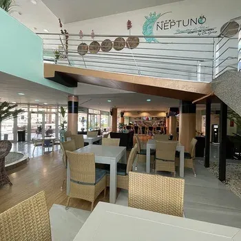 On Hotels: Neptuno, bright lobby with lounge area and restaurant.