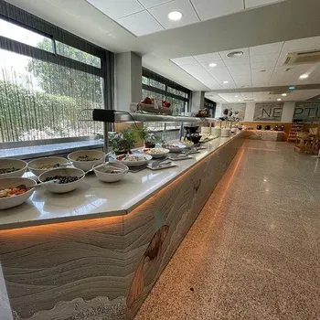Breakfast buffet at On Hotels: Neptuno, featuring fruits, cereals, and more.