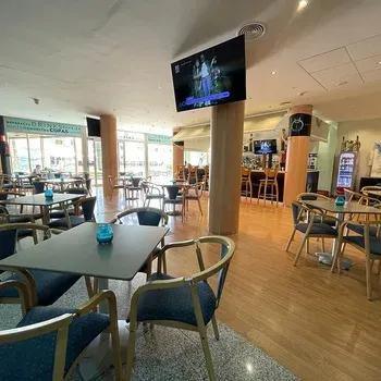 Interior lounge at On Hotels: Neptuno, featuring tables and chairs.