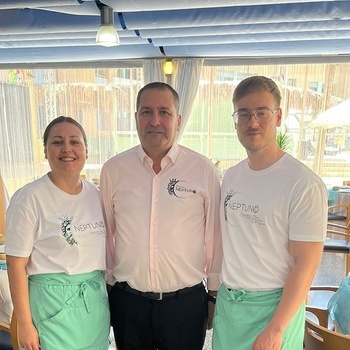 a man and two women wearing shirts that say neptune