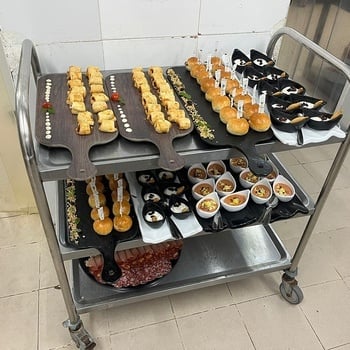 a tray of food on a stainless steel cart