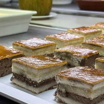 On Hotels: Neptuno desserts. Layered cakes with a glossy glaze.