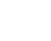 the hacienda village logo is white on a black background .