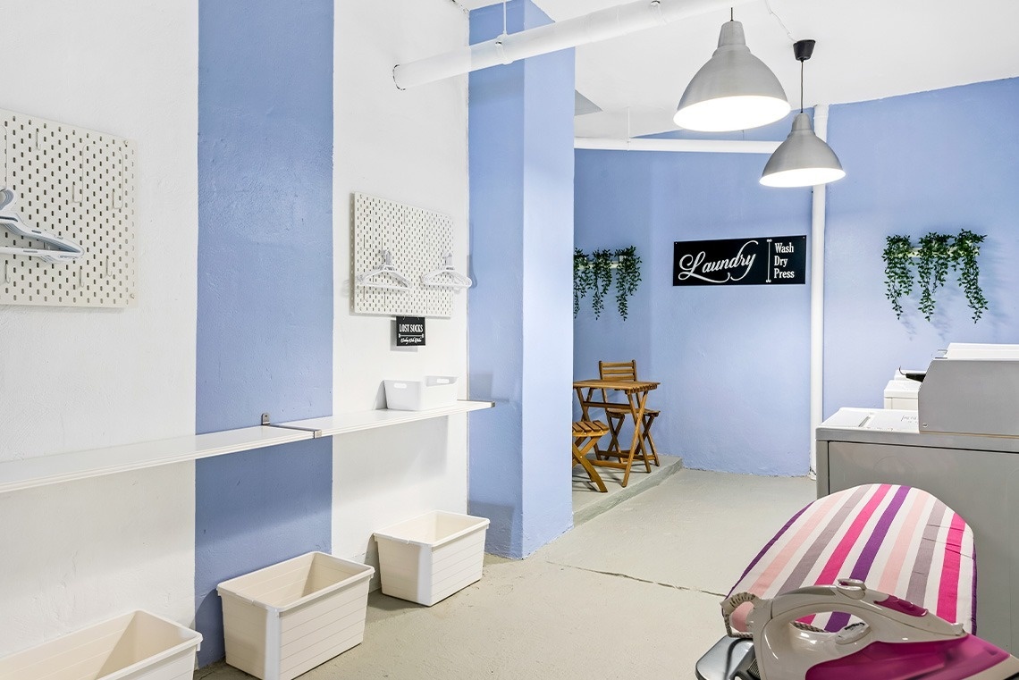 an aerial view of a row of houses with a pool in the middle