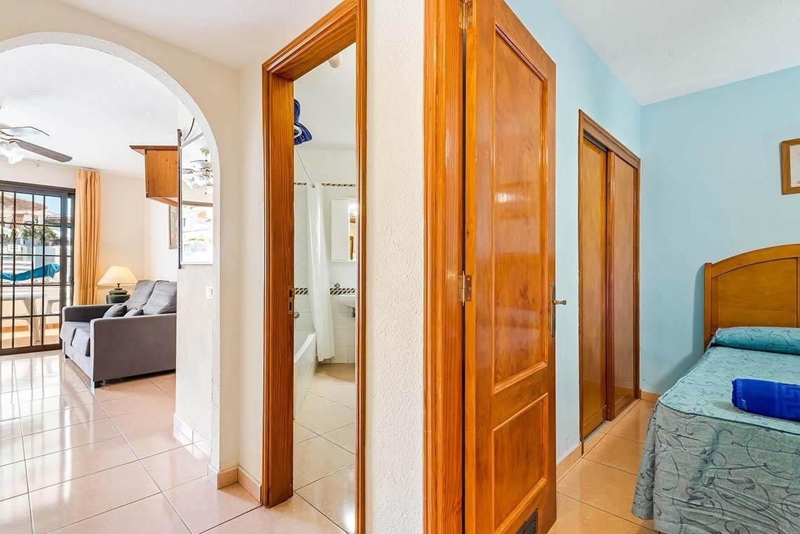 a bedroom with a bed and a couch in it