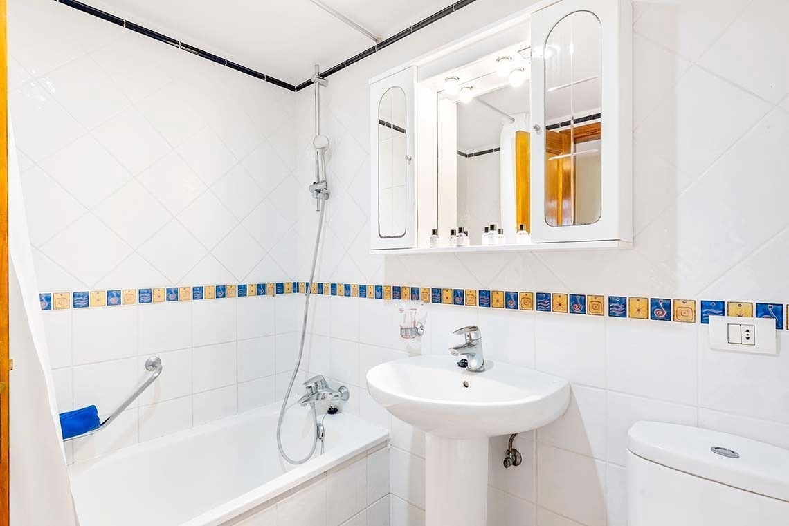 a bathroom with a bathtub sink and toilet