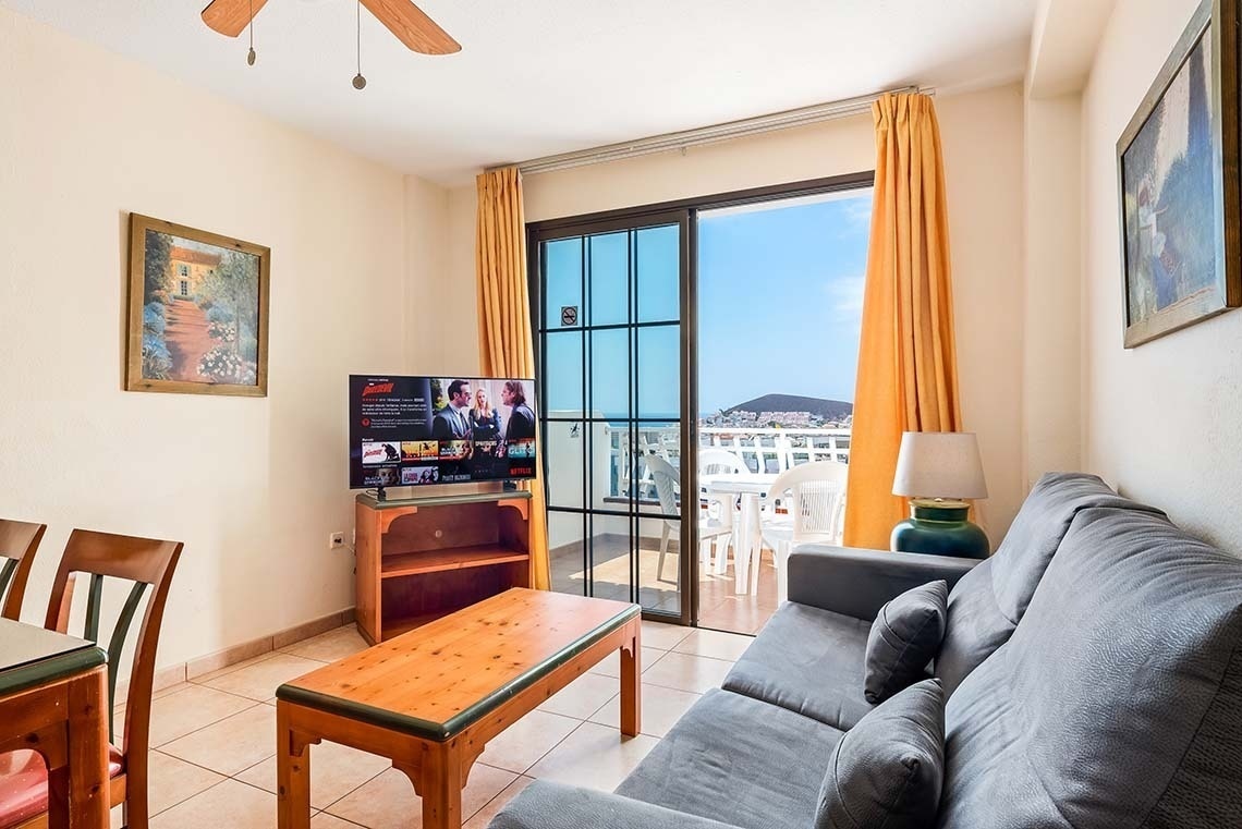 a living room with a flat screen tv that says netflix on it