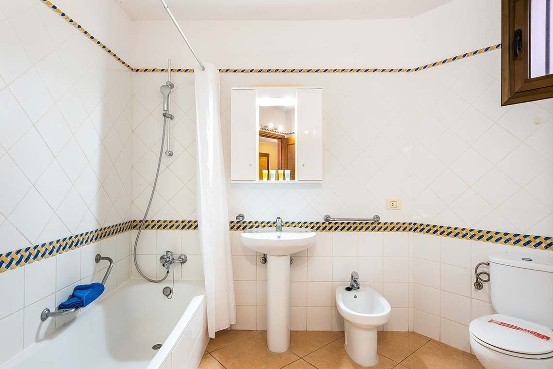 a bathroom with a sink toilet and bathtub