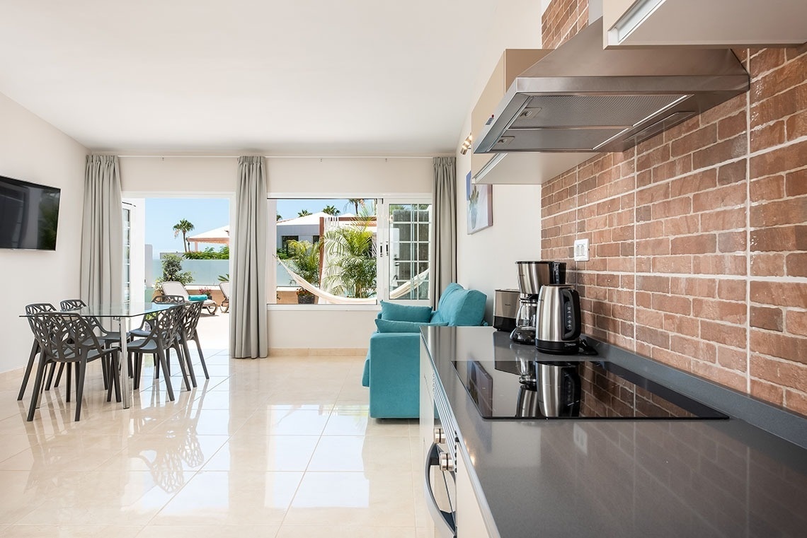 a kitchen with a stove top oven and a coffee maker