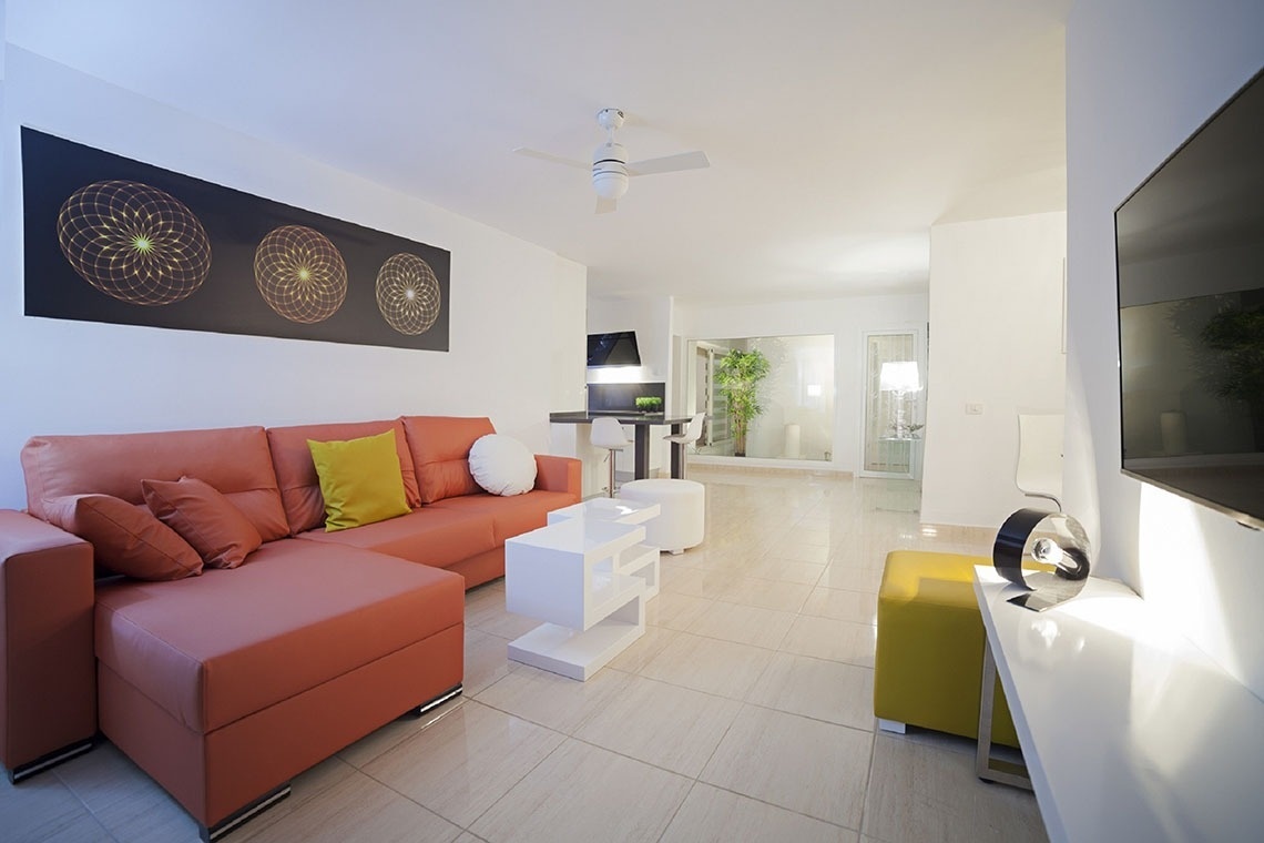 a living room with a couch and a flat screen tv