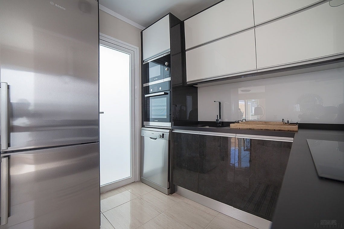 a kitchen with a bosch refrigerator and dishwasher
