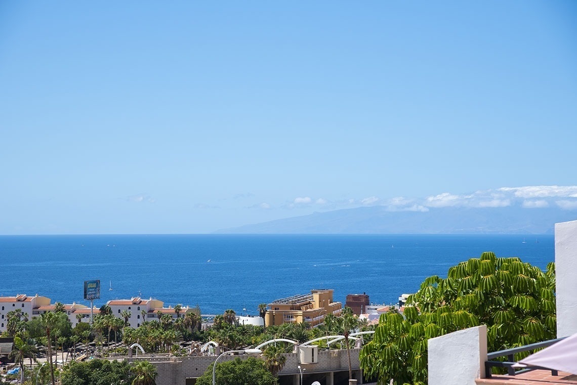 a view of the ocean from a hotel balcony
