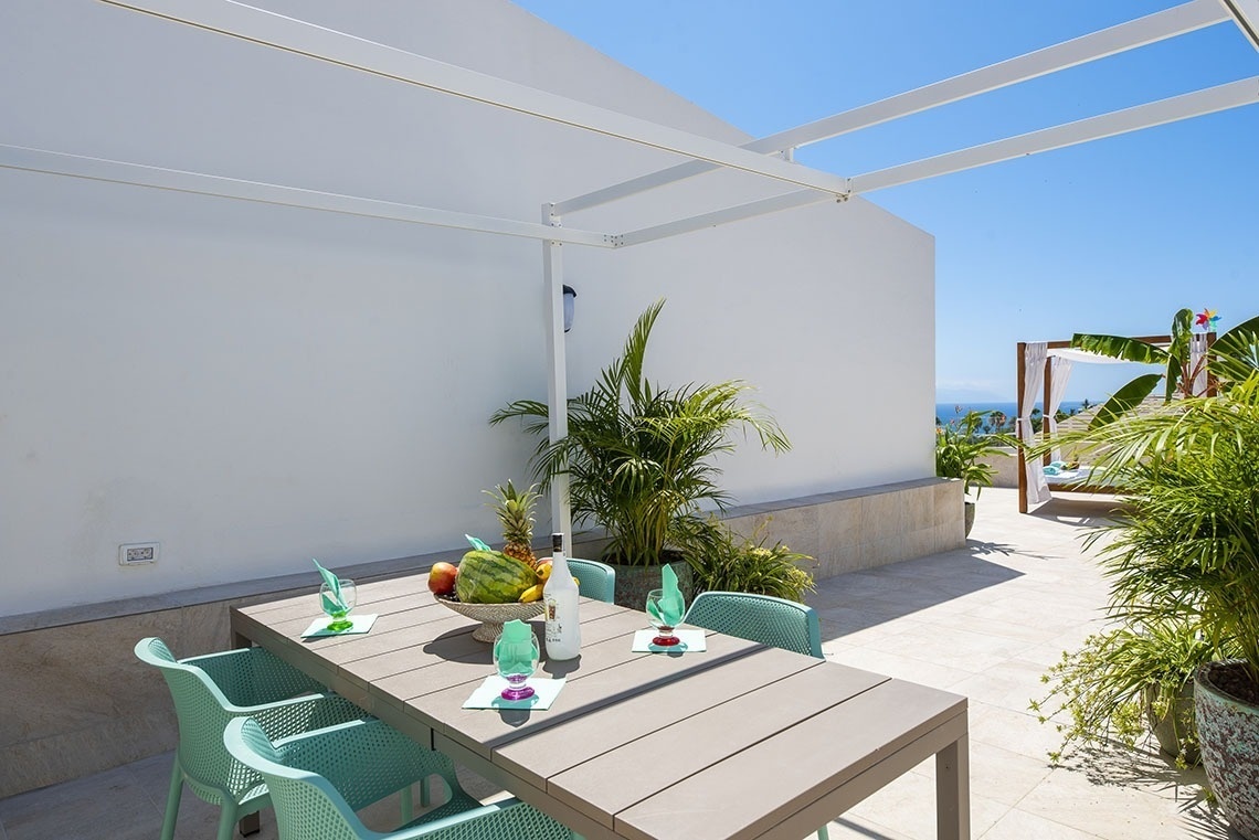 a table with a bowl of fruit on it