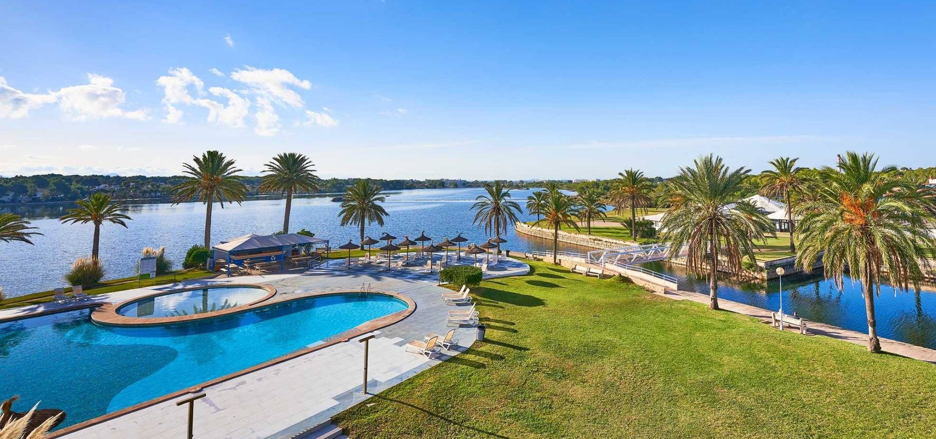 a large room with tables and chairs and a pool table