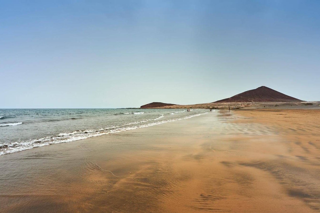 a group of women are lifting dumbbells in a swimming pool