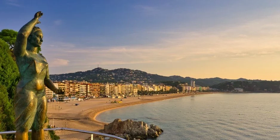 a boy in a yellow life preserver is splashing in a pool
